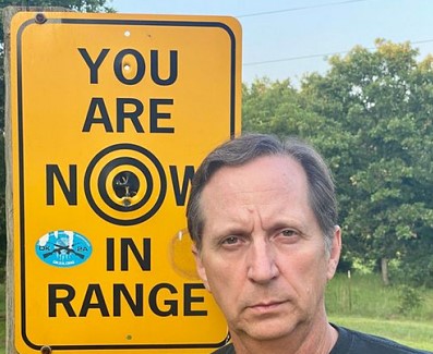 Don Spencer with his no trespassing sign